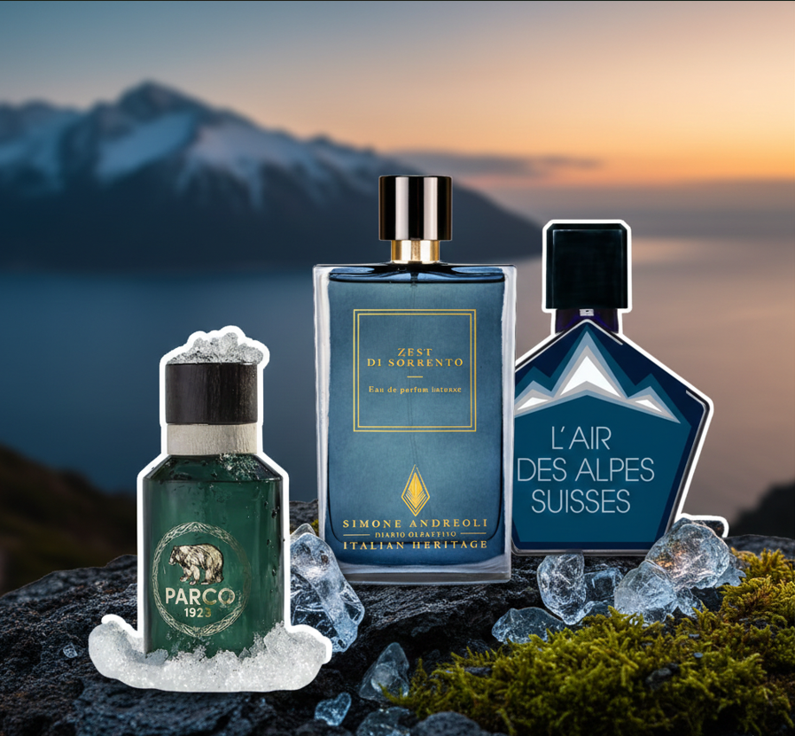 Composizione di profumi freschi di nicchia: Parco 1923, Simone Andreoli Zest di Sorrento e Tauer L'Air des Alpes Suisses su uno sfondo di montagne e ghiaccio, rappresentazione di fragranze rinfrescanti e agrumate. L'Atelier Dei Profumi Teramo