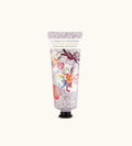 Tubetto Di Crema Mani Fragonard Heliotrope Gingembre Su Sfondo Con Dettagli Speziati E Floreali.