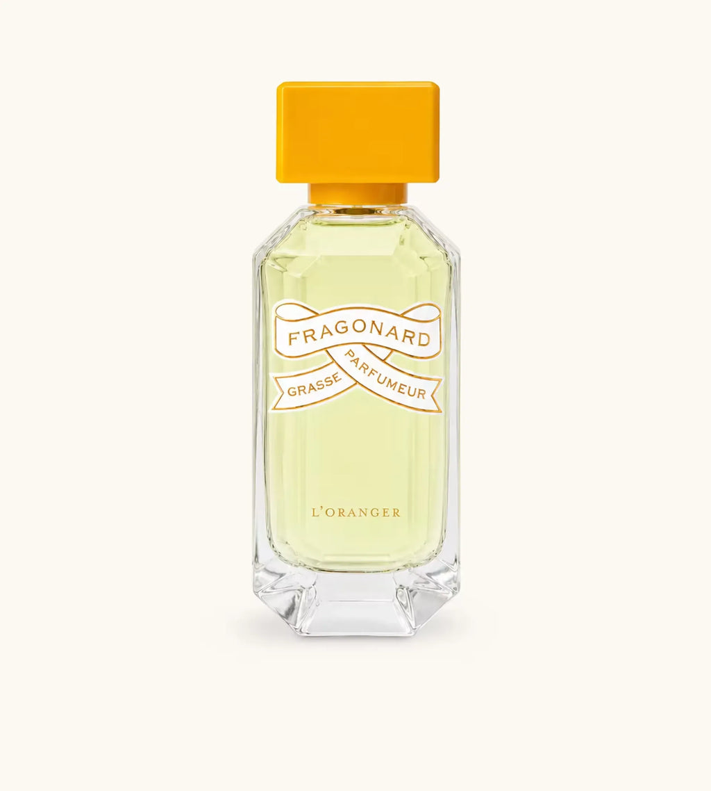 Flacone Di Profumo Fragonard L Oranger Eau De Parfum 50 Ml Su Sfondo Solare E Agrumato.