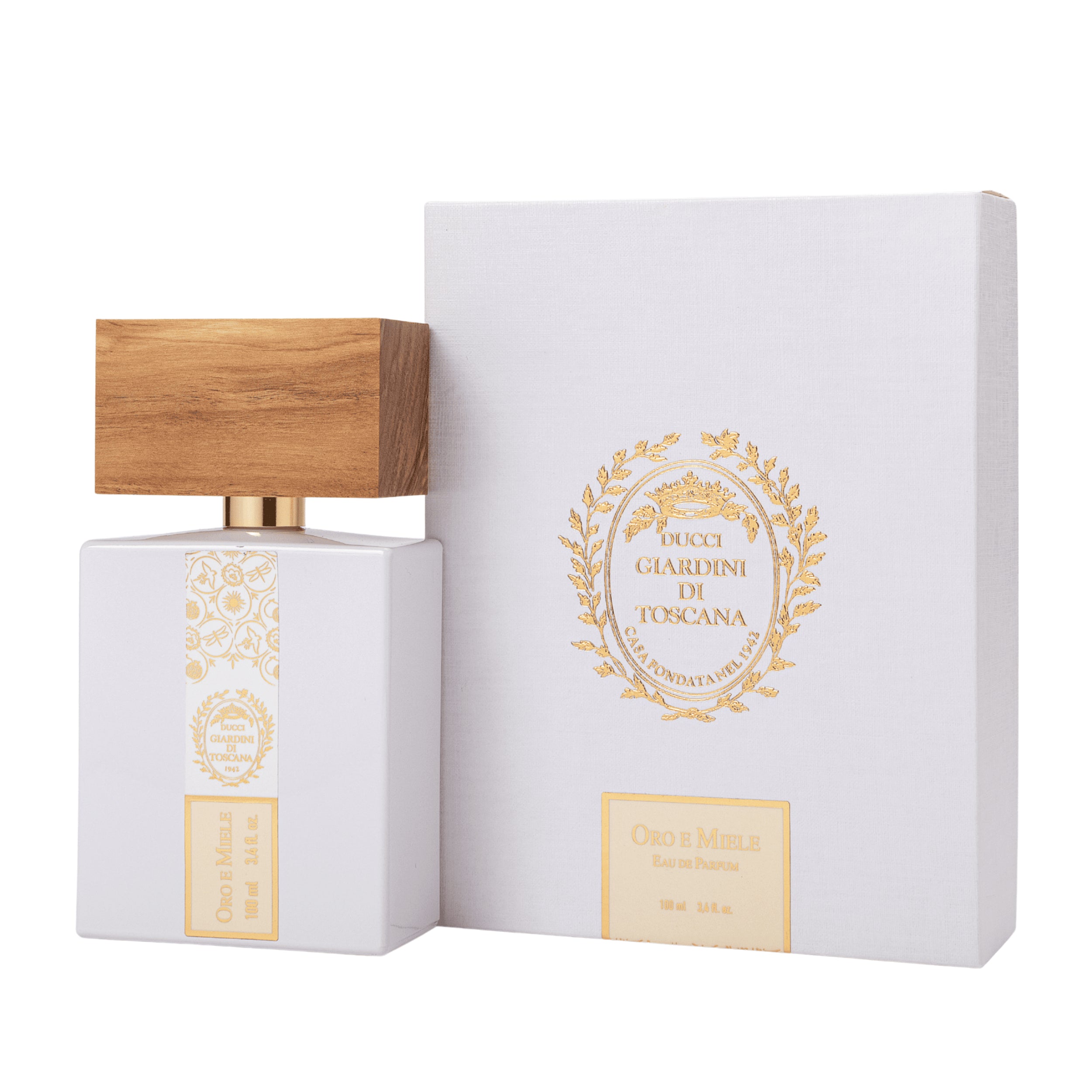 Il flacone di Oro e Miele Giardini di Toscana Eau de Parfum posizionato accanto alla sua scatola / confezione ufficiale da esposizione. | L'Atelier Dei Profumi